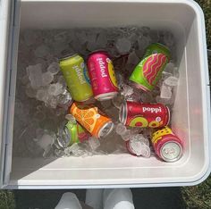 a cooler filled with lots of different types of soda