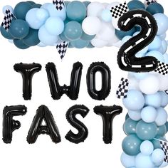 two fast balloons are in the shape of letters and checkered flags with black and white balloons