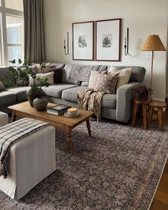 a living room filled with furniture and a large window