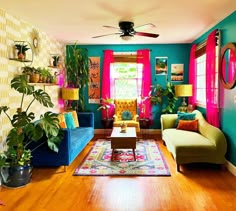 a living room filled with furniture and colorful walls