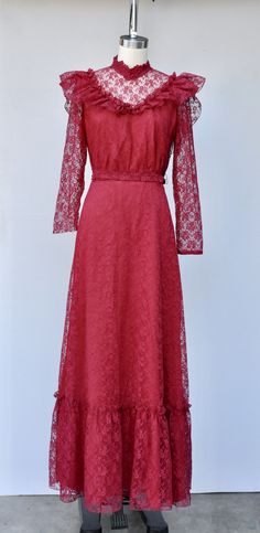 "Vintage Lace Maxi Dress in Vibrant Cranberry Color! Perfect for a vintage wedding !! This is STUNNING !! *Ruffled *Floral Lace *Lace is see through on neck and sleeves *Long Sleeves - Please note that the right sleeve was cut short - do not know why as the other one is original length. This is how we found it and sold As Is. Pretty simple job for a seamstress to shorten the other one to make them the same length. Priced accordingly! *Zip up on back *Floor Length *Lined - Lace even on back part Lace Victorian Dress, Maxi Lace Dress, Victorian Lace Dress, Cranberry Color, 70s Dress, Prairie Dress, Lace Maxi, Lace Maxi Dress, Vintage Lace