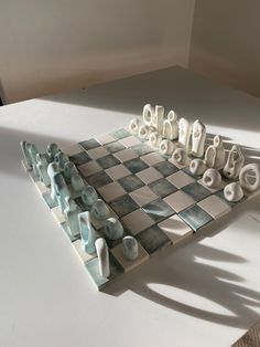 a chess board with several pieces arranged on top of it and one piece missing from the game