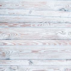 an old white wood background with some grainy boards on it's sides and the top part of the planks showing