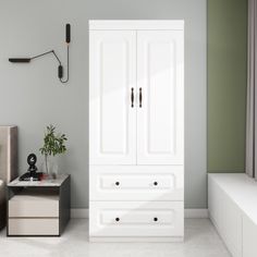 a white cabinet sitting in the middle of a room next to a bed and nightstand