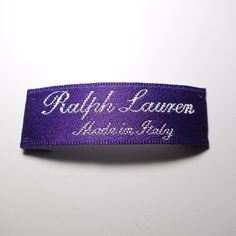 Ralph Lauren Purple Label made in Italy replacement sew on embroidered label tag. * Tracking Number Included * 1 - 4 Days Order Processing * Sourced from the reuse sector. * 100% authentic from a damaged garment. SIZE - 1.5 cm x 4.5 cm SUGGESTIONS - Luxury - Replacement Part ITEM CONDITION Please understand that since these items are vintage and/or recycled, they may in fact show a little sign of wear, aging, or slight discoloration. If we list something as New Old Stock (NOS) or new, it will be in excellent condition. Any other characterization is subject to having some visible signs of degradation. Embroidered Labels, Label Tag, Purple Label, Ralph Lauren Purple Label, Sew On, Tracking Number, Violet, In Italy, Ralph Lauren