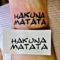 the words hakuna mata and hakuna mata tattooed on both wrists