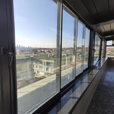 the view from inside an office building looking out onto a city