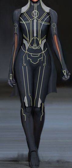 a woman in a futuristic suit walks down the runway