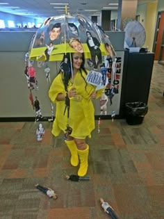 a woman in yellow is holding an umbrella