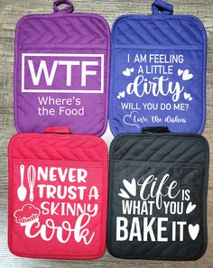 four oven mitts with different sayings on them