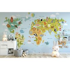 a child's room with a map of the world painted on the wall and toys