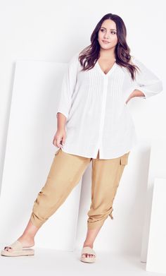 Discover everyday luxury in the relaxed stylings of the stone Shiloh Ruched Pant. Gorgeously soft to the touch, these sleek pants feature a tapered relaxed fit, cargo-style pockets and drawstring ruching to the hem. Key Features Include: - Elasticated waistband - High rise pull-on fit - 2 hip pockets and 2 function leg pockets with flap closure - Relaxed fit - Tapered towards hemline - Cropped with cinched detail Perfect for work, lazy days and everything in between, dress it smart-casual with a Ruched Pants, Draped Cardigan, Plus Size Cargo Pants, Party Dress Sale, Everyday Luxury, Sheer Shirt, Drape Cardigan, Leggings Sale, Plus Size Pants