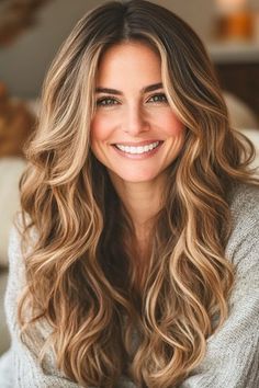 Save this pin for the best fall hair color ideas. Long, wavy layers create a romantic and feminine shape, perfect for those crisp autumn days. The balayage technique allows for a seamless blend of shape, mimicking the natural sun-brightened effect of summer hair transitioning into fall. Fall/winter Highlights, Fall Highlights And Lowlights, Long Hairstyles With Layers Wavy, Layered Light Brown Hair, Long Wavy Hair With Layers, Long Layered Wavy Hair, Curled Hairstyles For Long Hair, Long Wavy Layers, Long Wavy Hairstyles