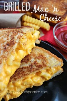 grilled mac'n cheese sandwich on a black plate