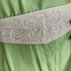 Vintage beaded belt in beige shade. A beautiful accent for a wedding dress, or party outfit. Fits waist 27-28" Elegant Beaded Bridal Belt, Elegant Beaded Fitted Bridal Belt, Embellished Fitted Sash For Party, White Embroidered Belt For Party, Elegant Adjustable Embellished Bridal Belt, Embellished Party Sash, Elegant Embellished Sashes For Party, Elegant Embellished Adjustable Bridal Belt, Elegant Embellished Bridal Belt For Evening