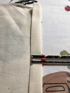 the sewing needle is being used to sew on fabric