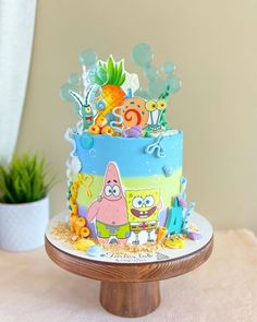 a spongebob themed birthday cake on a table