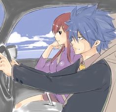 two people sitting in a car, one holding the steering wheel