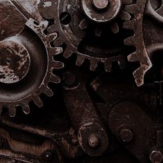 an old rusty machine gears with rust on them