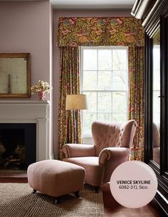 a chair and ottoman in front of a window