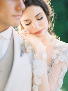 a bride and groom pose for a photo