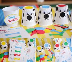 some paper cups with dogs on them sitting on a table