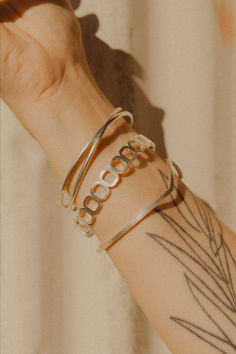 Solid and firm, this geometric bracelet was designed to feel like a foundation or base. Like building blocks that form a place to build from, wear the bracelet as a reminder of your solidity and see the stable ground on which you build. Slide this bangle-style bracelet over your wrist for an easy-on and off, and stack it alongside with all your favorites. Silver comes with a textured, raw finish. Gold vermeil is high-polished shine. Architectural Jewelry, Geometric Bracelet, Bangles Style, The Foundation, Elevate Your Look, Fashion Bracelets, Building Blocks, Gold Vermeil, Feel Like