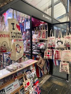 the london souvenirs are on display in the store front window, and there is no image here to provide a caption for