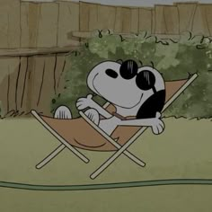 a cartoon dog sitting in a lawn chair with sunglasses on it's face and eyes closed