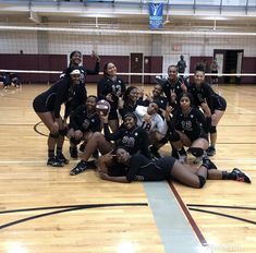 the volleyball team is posing for a group photo