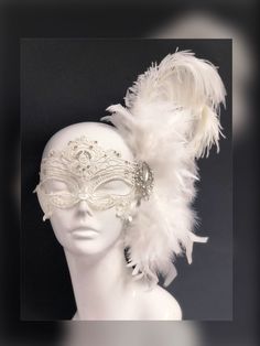 Off-white feather mask with gorgeous crystal on silver brooch embellishment, perfect for your all-white theme Masquerade Ball or Diner en Blanc! The mask pictured comes with 40 rhinestones on the lace mask. You have the option to purchase the mask without rhinestones with feathers & brooch only as well! Thank you for supporting small businesses and hope our products bring you and loved ones some joy and humor in these trying times. S H I P P I N G - Current processing times range 5-7 days. P Female Masquerade Mask, Dove Mask Masquerade, Angel Masquerade Mask, White Masquerade Mask Men, Masquarede Ball Masks, Bridgerton Masquerade, Masquerade Mask Aesthetic, Masquerade Aesthetic, White Masquerade Mask