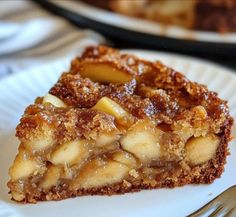 a piece of pie sitting on top of a white plate