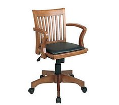 a wooden office chair with black leather seat