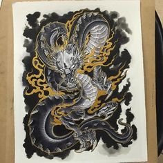 an ink drawing of a dragon with yellow and black flames on it's body