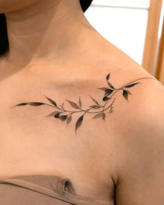 a woman with a tattoo on her chest