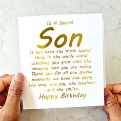 someone holding up a birthday card with the words, to a special son