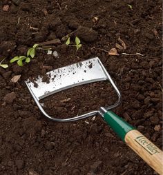 a garden tool laying on top of dirt