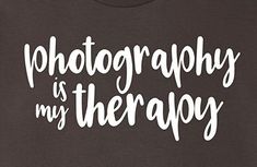 the words photography is my therapy written in white on a black t - shirt that says photography is my therapy