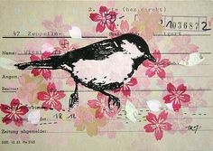 a bird sitting on top of a piece of paper with flowers and numbers in it