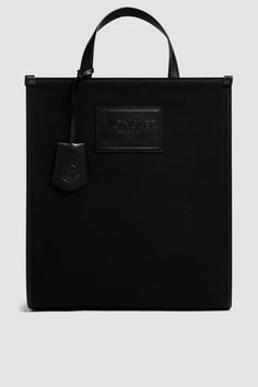 A versatile design fit for a range of occasions, the Alanah tote bag is an elevated take on a practical accessory. Crafted from canvas, the spacious bag is embellished with a supple leather details. Designer Canvas Tote Bag With Top Handle, Designer Canvas Tote Bag With Top Carry Handle, Luxury Coated Canvas Bag With Dust Bag, Luxury Black Canvas Bag, Designer Coated Canvas Bag With Double Handle, Luxury Canvas Bag With Dust Bag Included, Designer Double Handle Coated Canvas Bag, Luxury Black Coated Canvas Bag, Designer Canvas Bags With Double Handle