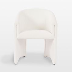 a white chair sitting on top of a white floor