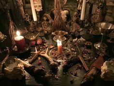 a table topped with candles and other items