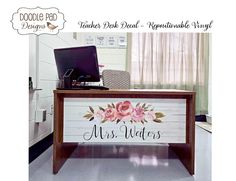 a desk with flowers painted on it and the words mrs roberts written in black ink