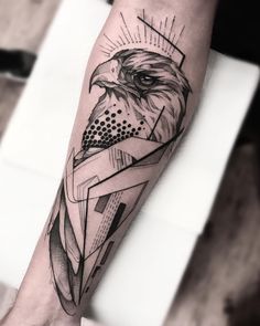 a black and white photo of an eagle with geometric shapes on it's arm