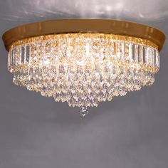 a chandelier hanging from the ceiling in a room