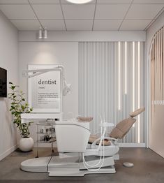 a dentist's office with a chair and monitor