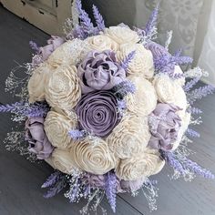 a bridal bouquet with lavender and white flowers