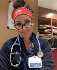 a woman in scrubs with a stethoscope around her neck and headband