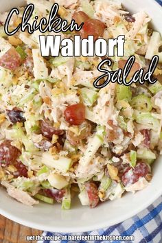 a white bowl filled with chicken salad on top of a blue and white checkered table cloth