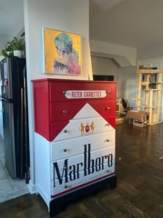 A dresser painted to look like a pack of Marlboro Red Cigarettes Aesthetic Shoe Storage Ideas, Cool Room Wallpaper, Spicy Room Decor, Fun Storage Ideas, Random House Decor, Bar Themed Room, Weird House Decor Diy, Unique Home Furniture